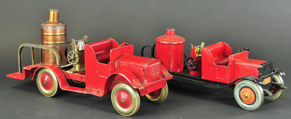 TWO FIRE TRUCKS: Light pressed steel, includes an Oh-Boy Kiddie Metal toy fire engine, and a Hercules Fire Dept. Service truck, both with boilers. 18" - 19" l.