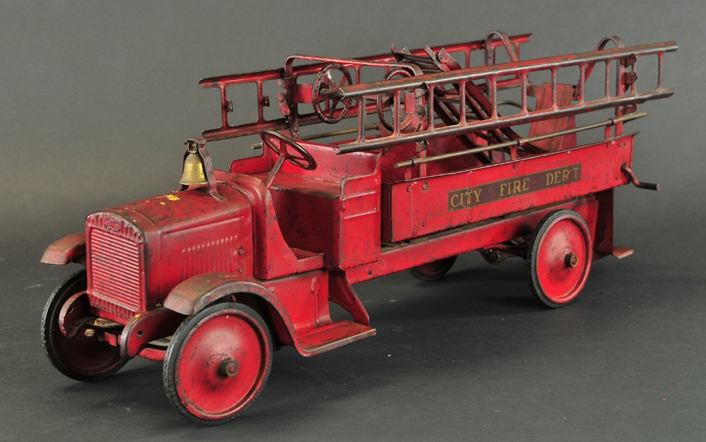 "STEELCRAFT" FIRE TRUCK: Pressed steel, all red, open driver's seat with low body, supporting rails for hose wheels, side ladders, rear step, gong on radiator, disc wheels with rubber tires, decal reads "City Fire Dept.". 26"