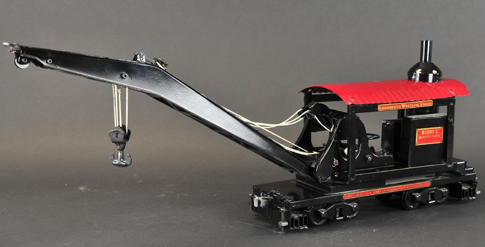 BUDDY 'L' LOCOMOTIVE WRECKING CRANE: Contemporary issue, pressed steel, painted in black overall w/red roof, boiler housed in open body, features tall boom w/nickel pulleys. 27 1/4" in extended length.