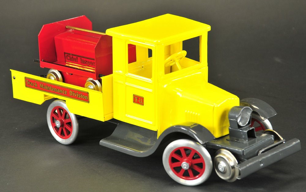 PRESSED STEEL MAINTENANCE TRUCK WITH CART: Contemporary T-Production, pressed steel, painted in bright yellow & red, limited production to use on Buddy 'L' outdoor railroad track, body contains handcar storage track. 16" l.
