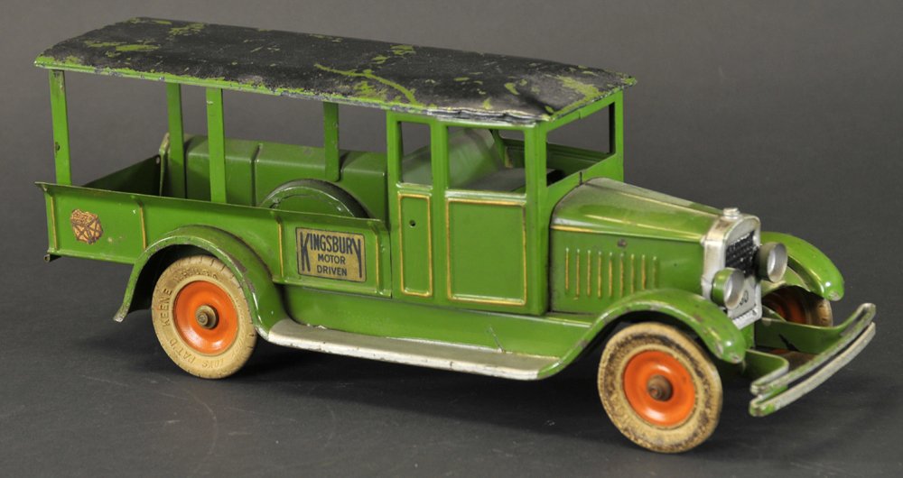KINGSBURY HUCKSTER: Pressed steel, painted in green, enclosed cab, open side delivery body with full canopy roof, license reads "360" mechanical action, metal wheels, decal on hood reads, "Motor Driven". 13 1/2" l.