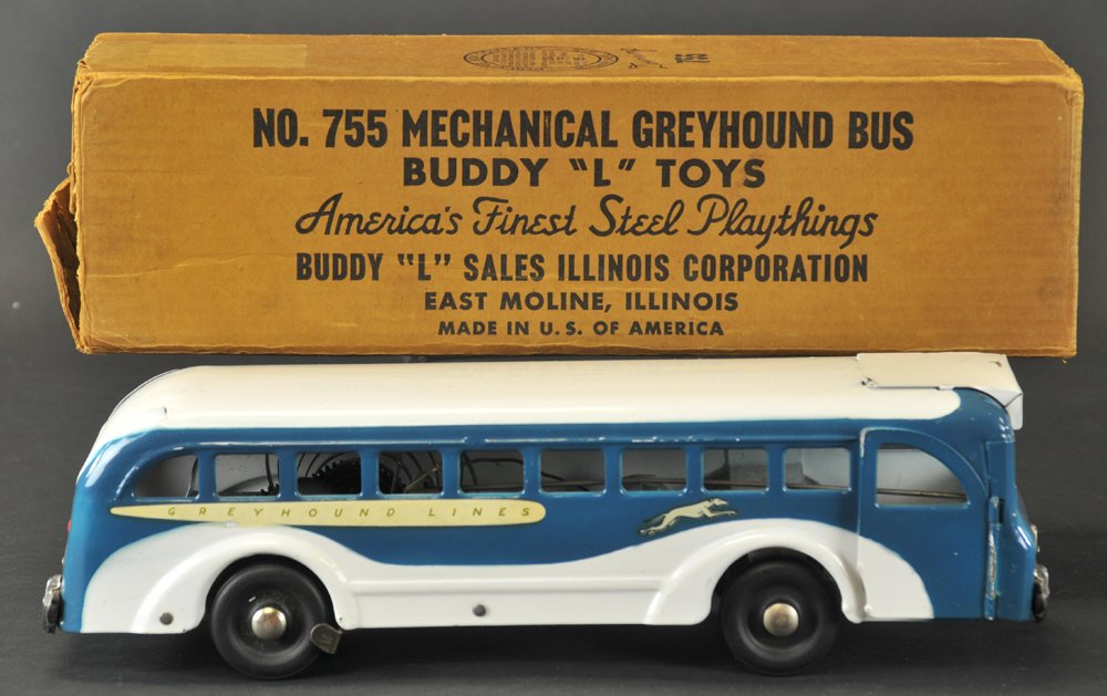 BOXED BUDDY 'L' GREYHOUND BUS: Pressed steel, classic blue & white paint, decaled with "Greyhound" logo & name, battery-operated tail light, wind up rolling action opens doors, rings bell. 16 1/2" l.