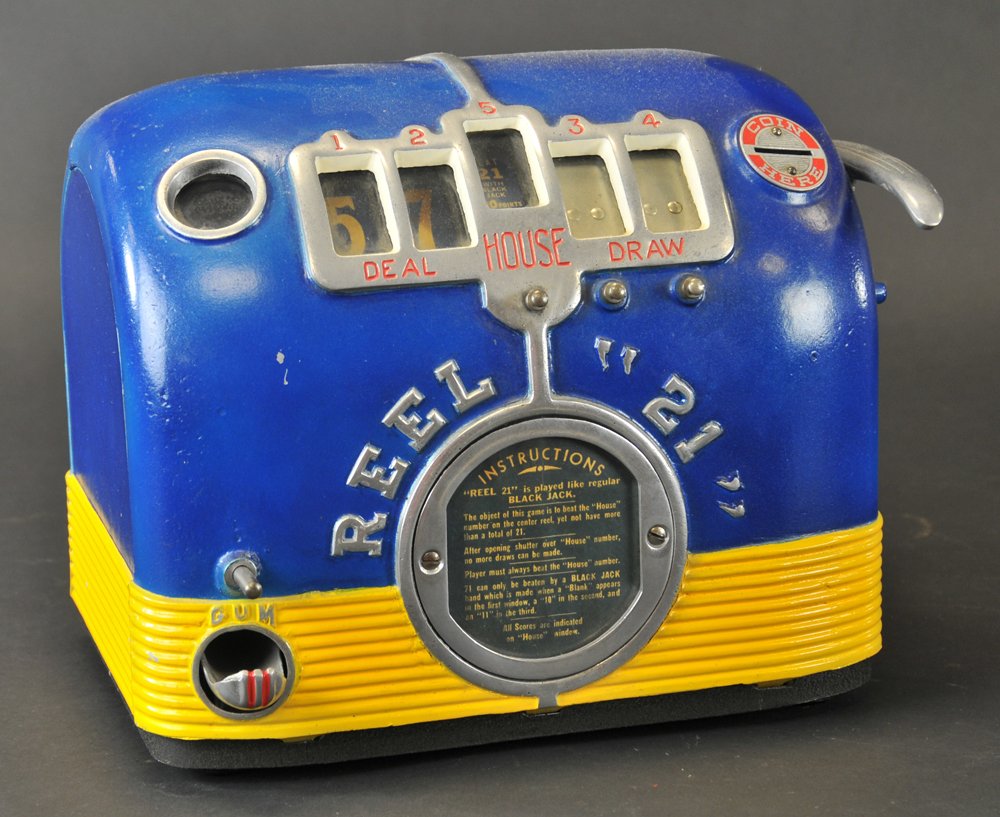 REEL "21" COIN OP BLACKJACK MACHINE: Heavy die-cast case, bright blue and yellow with glass view slots, dispenses gum balls on one side, quite novel, includes a key. 11" w. x 10" h.