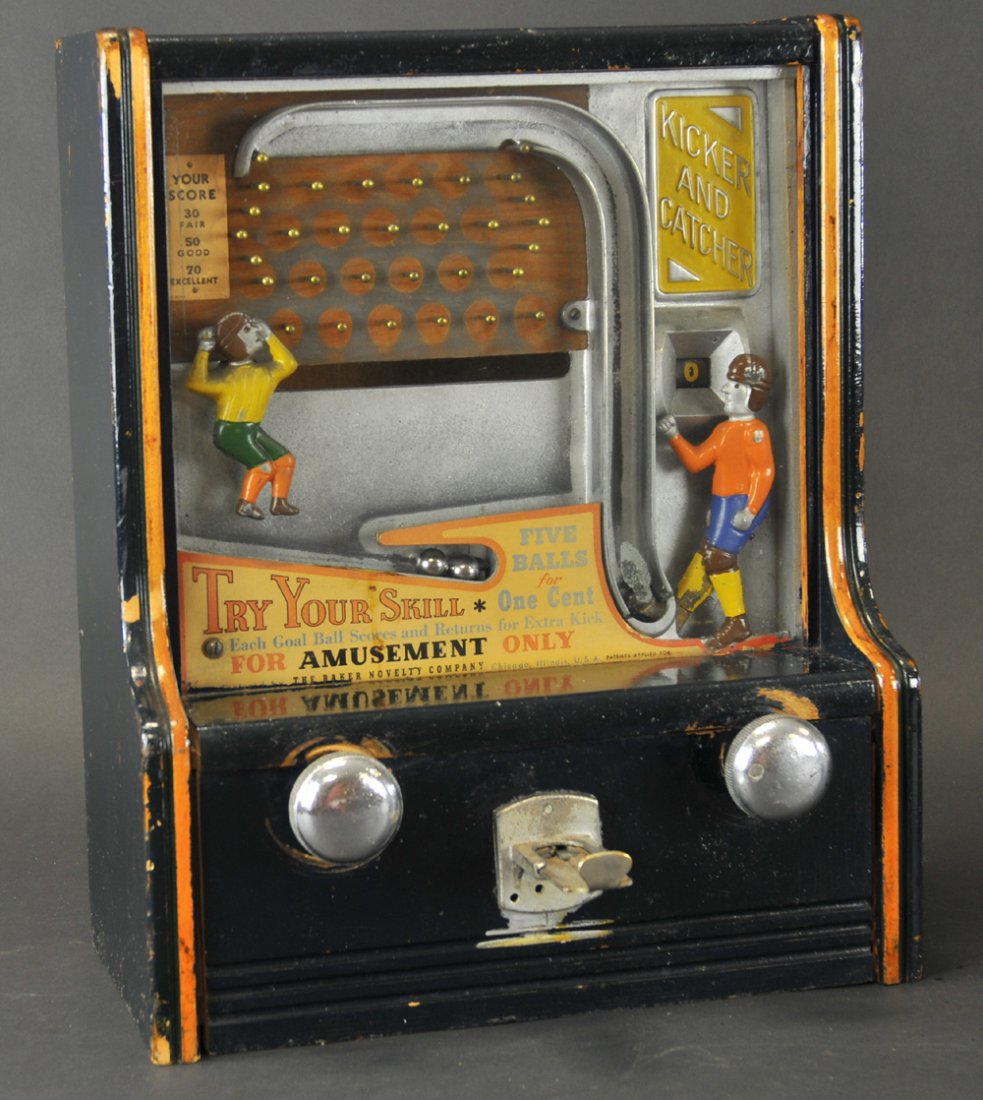 KICKER & CATCHER ARCADE SKILL MACHINE: Wooden case, die-cast figures, nice action, colorful board, penny machine. 17" h. x 14" w.