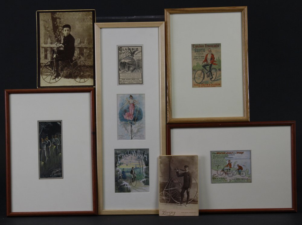 BICYCLE AD CARDS LOT: Early bicycle cards and photos depicting bone crusher examples and whimsical lithographed trade cards, all framed but two photos. 4 1/4" x 6 1/2" to 7 1/2" x 20 1/2".