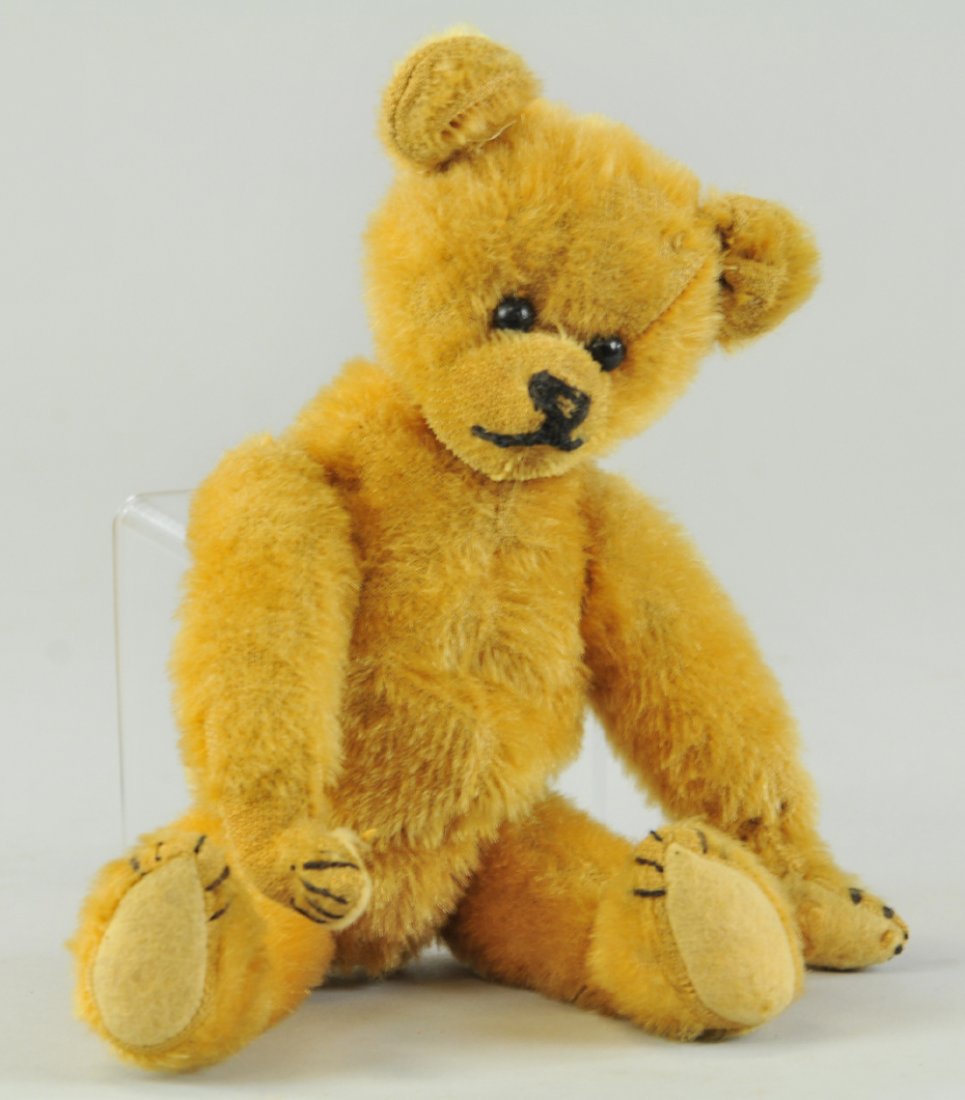 IDEAL AMERICAN TEDDY BEAR: Painted feet and paws, shoe button eyes, ears reattached, but original, felt missing on one paw, hole on left paw, small Roosevelt type bear that was given out on campaign trail, rare. 10" h.