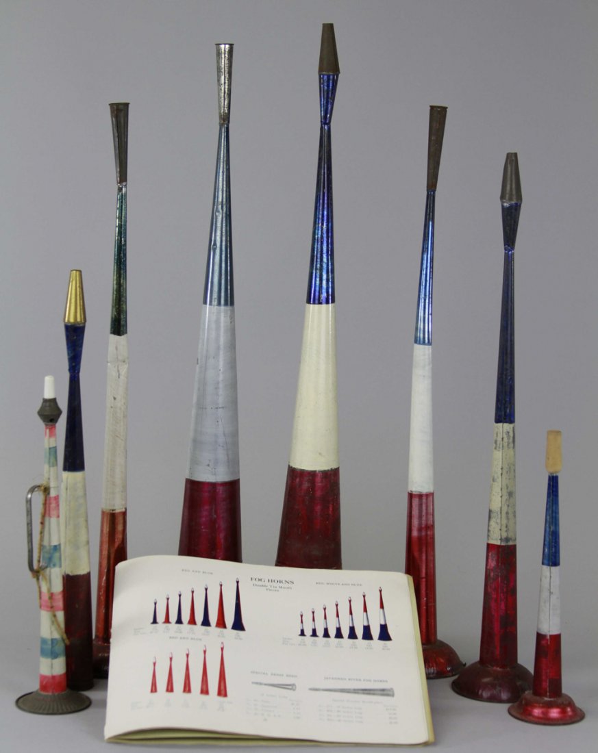 GROUPING OF PATRIOTIC TIN HORNS & HORN CATALOG: Nice grouping of eight red, white, and blue tin horns of various sizes, along with a Leo Schlesinger & Co. toy catalog that depicts the horns along with many other early children's toys. 11" - 26".
