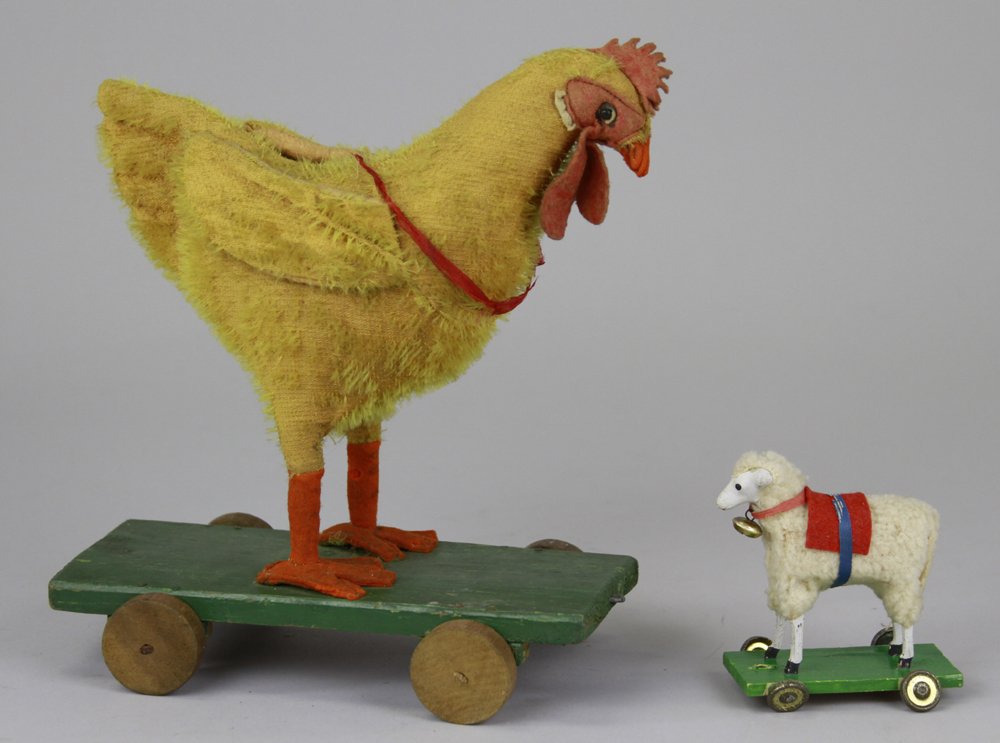 LAMB & CHICKEN ON PLATFORM PULL TOYS: Small composition head lamb with some loss of fur to body, and large yellow chicken with interesting face pull toys, each on green wood platform. 3" - 9".
