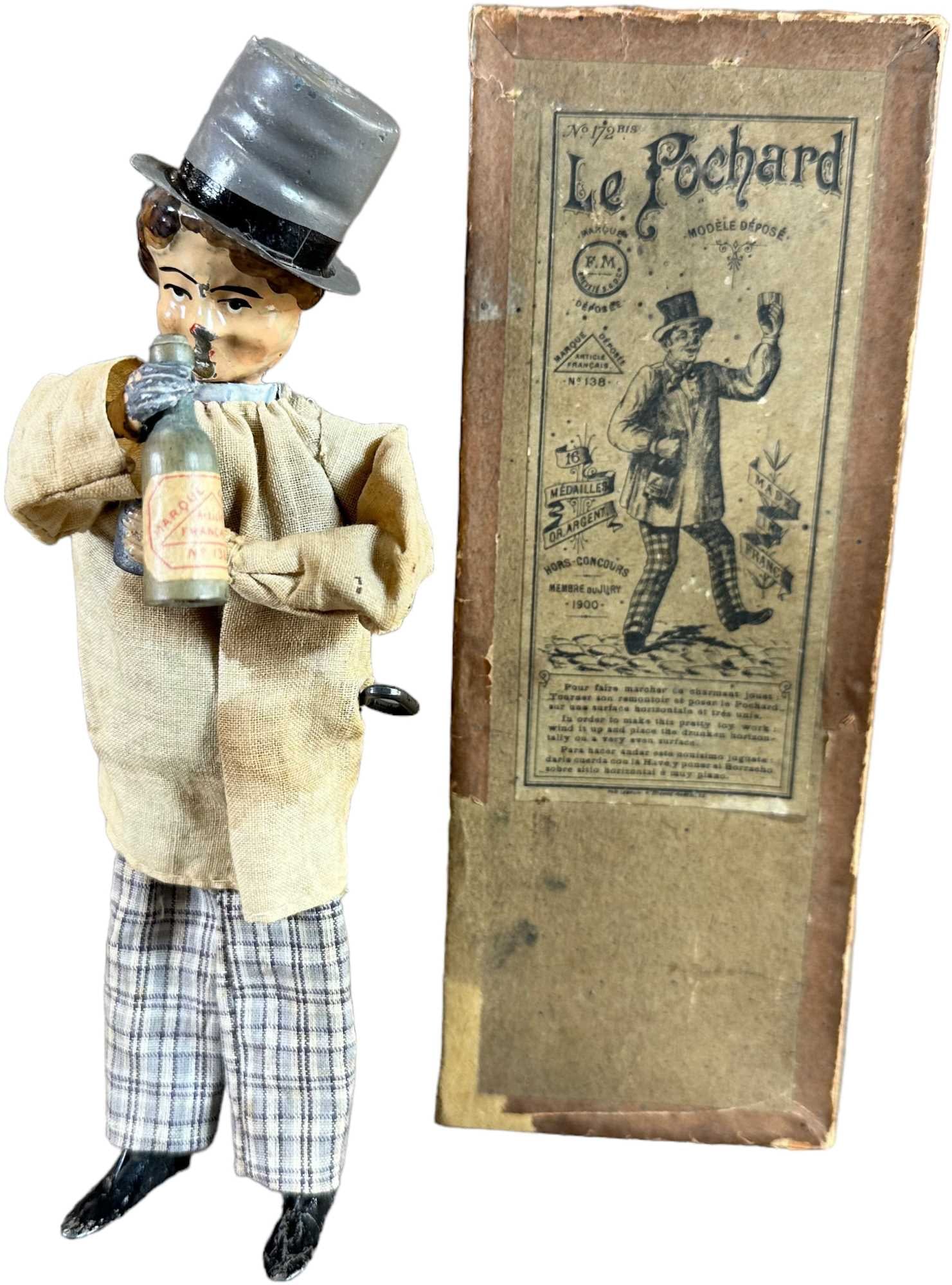 BOXED FERNAND MARTIN DRUNKARD: 170. BOXED FERNAND MARTIN DRUNKARD | France, "Le Pochard," circa 1899, one of the best selling of Martin toys in its time, figure swings arms as he lifts cup to mouth and back. | 8" h. | (Excellent to