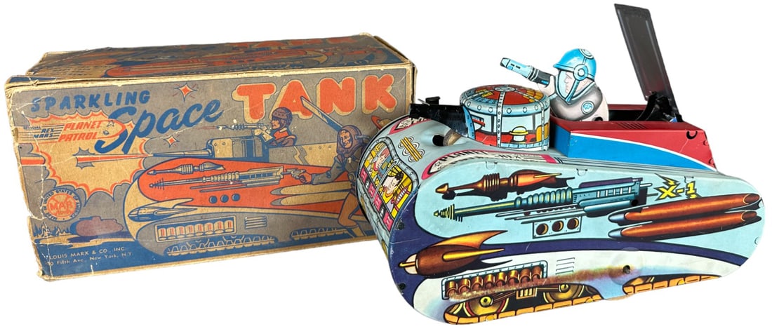 MARX BOXED SPARKLING SPACE TANK: 242. MARX BOXED SPARKLING SPACE TANK | USA, wind-up mechanism causes tank to roll forward, stop as astronaut pops out to seemingly fire his space gun, then returns and rolls on. | 10" l. | Original bo