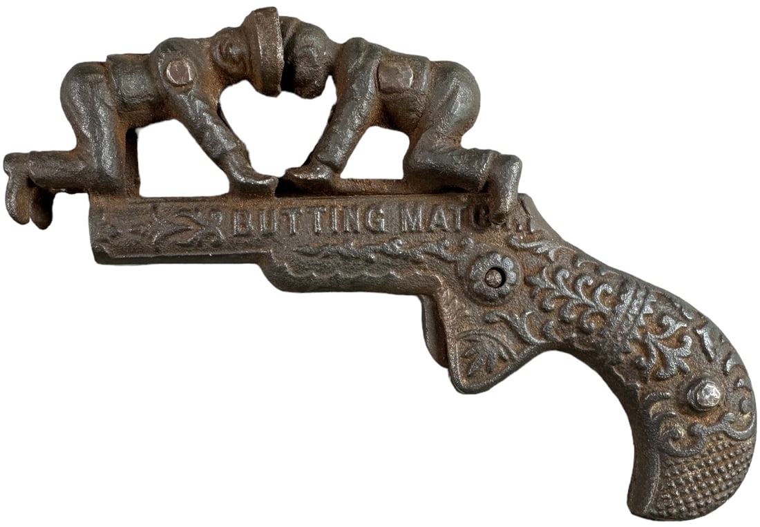 IVES BUTTING MATCH ANIMATED CAP GUN: 1334. IVES BUTTING MATCH ANIMATED CAP GUN | Action is two boys butting heads. | 5" l. | (Very Good Condition) | $200 - $400