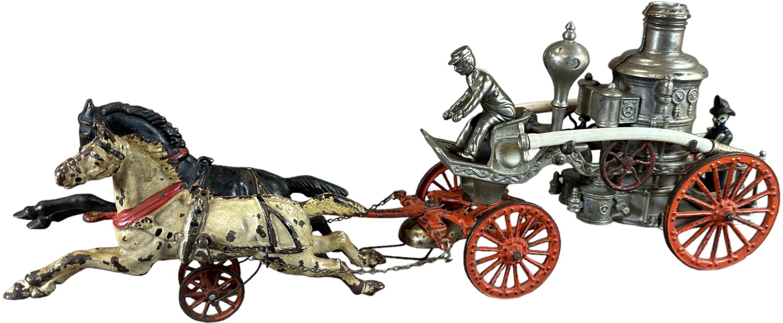 IDEAL MFG HORSE DRAWN FIRE PUMPER: 1441. IDEAL MFG HORSE DRAWN FIRE PUMPER | 22" l. | Original rear figure, replaced front figure, overall (Very Good to Excellent Condition) | $500 - $750