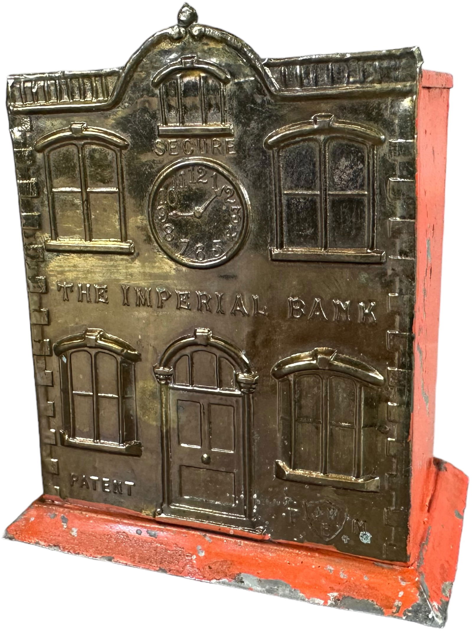 IMPERIAL BANK MECHANICAL BANK: 102. IMPERIAL BANK MECHANICAL BANK | John Walker, England circa 1890, this is believed to be the only known example. Book example featured on page 130 of Dan Morphy's "Official Price Guide to Mechanic