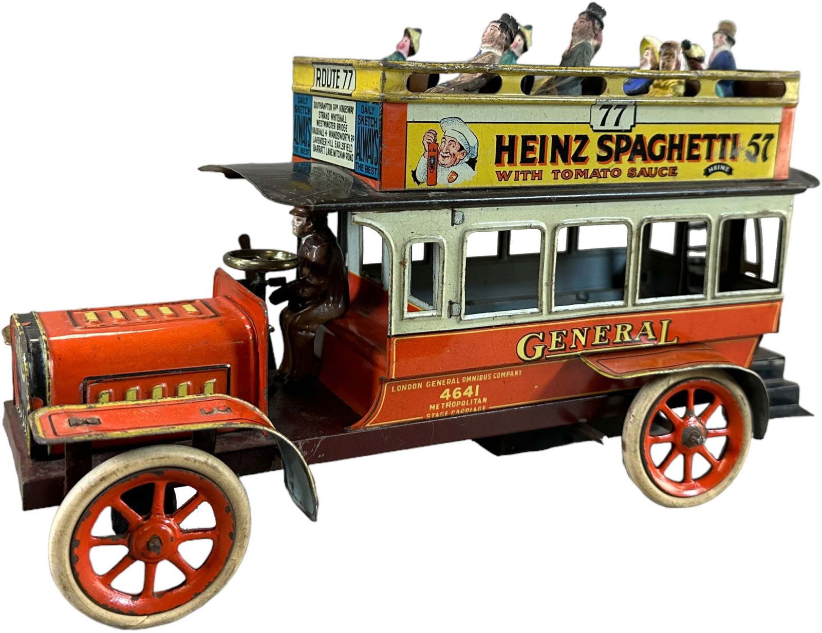 BING ADVERTISING DOUBLE DECKER BUS: 255. BING ADVERTISING DOUBLE DECKER BUS | Germany, wind-up, very deluxe example with lead wheels and rubber tires, attractive lithography with Heinz Spaghetti and Bird's Custard Powder advertised on t