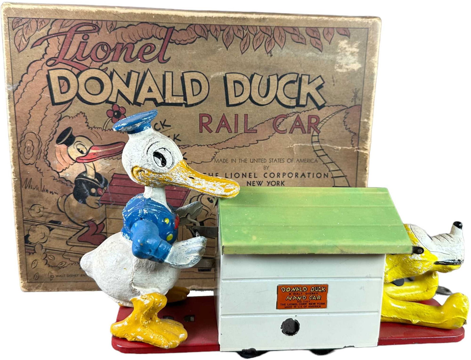 BOXED LIONEL DONALD DUCK RAIL CAR: 365. BOXED LIONEL DONALD DUCK RAIL CAR | 10.5" l. | Wind-up mechanism needs adjustment, part of the end flap on box is detached and not present, (Very Good to Excellent Condition) | $300 - $600