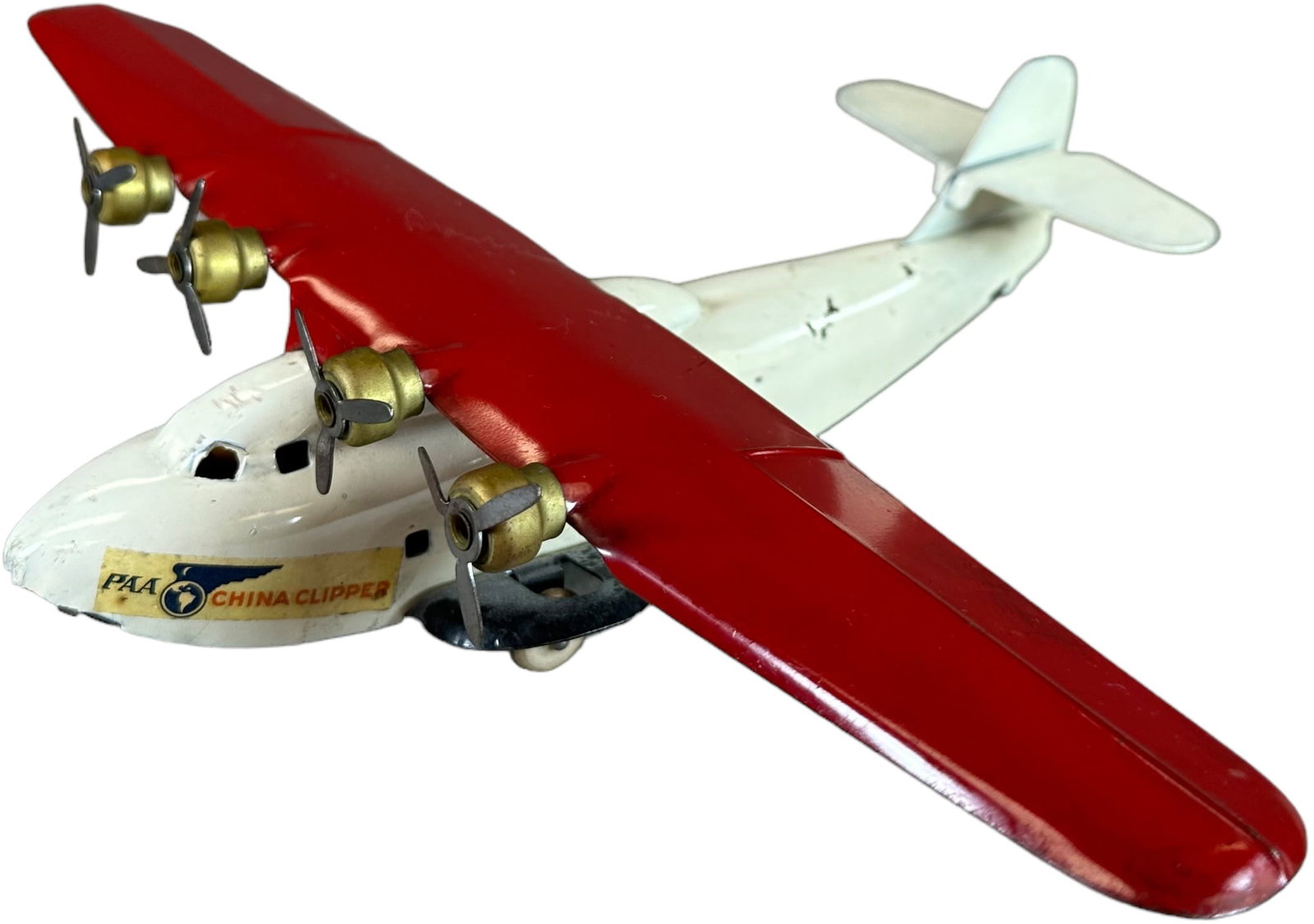 WYANDOTTE WHITE CHINA CLIPPER PLANE: 503. WYANDOTTE WHITE CHINA CLIPPER PLANE | 13" l. | Light bulb added to inside, original paint in (Excellent to Pristine Condition) for this toy. | $200 - $400