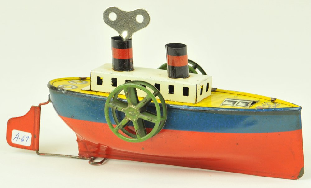ARNOLD PADDLE WHEELER: Germany, c. 1920, #1200, lithographed tin, green tin side wheels, red and blue hull, white cabin, two funnels, clockwork driven, graphics on deck. 6" l.