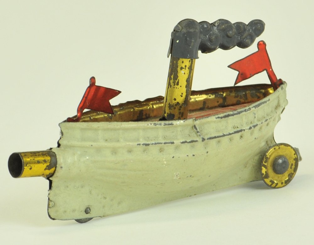 MEIER BOAT PENNY TOY: Germany, circa 1905, hand painted in white hull, spirit painted red, features tube at bow able to contain peas for shooting when side lever is pulled. 4 1/4" l.