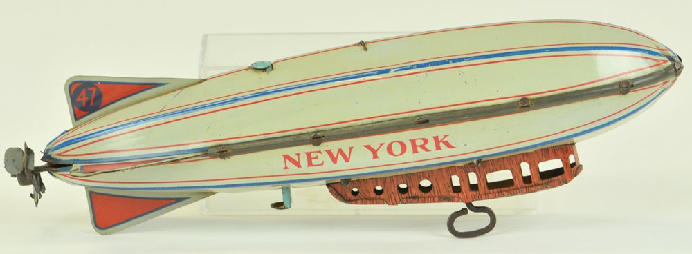 "NEW YORK" ZEPPELIN: Strauss, lithographed tin, reads "New York" on sides, clockwork mechanism under gondola, nice action. 9 1/2" l.