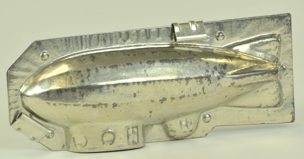 ZEPPELIN CHOCOLATE MOLD: Two-part mold with clamps, nice detail to body and gondola, fully tinned. 8" l.