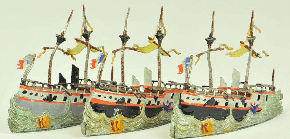 LOT OF THREE HEYDE SHIPS AT SEA: Germany, hand painted examples, very well detailed, each molded in sinking depiction with stern at wave line, lead ships feature stacks, masts, and flags, fully railed vessels. 3 3/4" l.