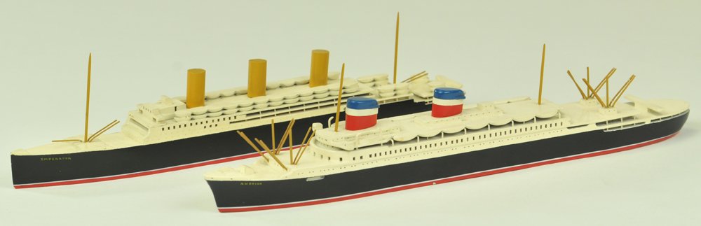LOT OF TWO WOODEN OCEAN LINER MODELS: Van Ryper, Vineyard haven, Mass., well detailed and hand painted overall, hand crafted liner, molded stacks, rows of lifeboats and ricky painted hulls, name stamped on base. 10 1/2" - 11 1/4" l.