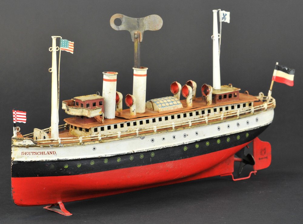 MARKLIN "DEUTSCHLAND" OCEAN LINER: Germany, #5026/33, made between 1915 and 1927, hand painted, red, white, and black band hull, brown deck, white cabin with brown roof, two masts, one with the Norddeutscher Lloyd Company flag, clockwo