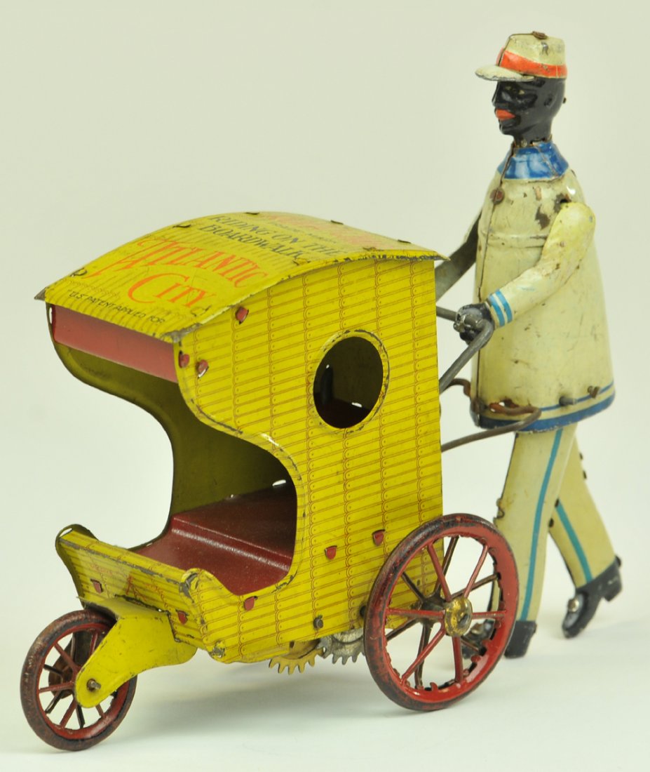 STOCK BOARDWALK ROLLO CHAIR: Germany, lithographed tin, a fine depiction of suited man the once popular wicker styled boardwalk chairs, clockwork driven, roof reads, "Riding the Boardwalk, Atlantic City". 7" l.