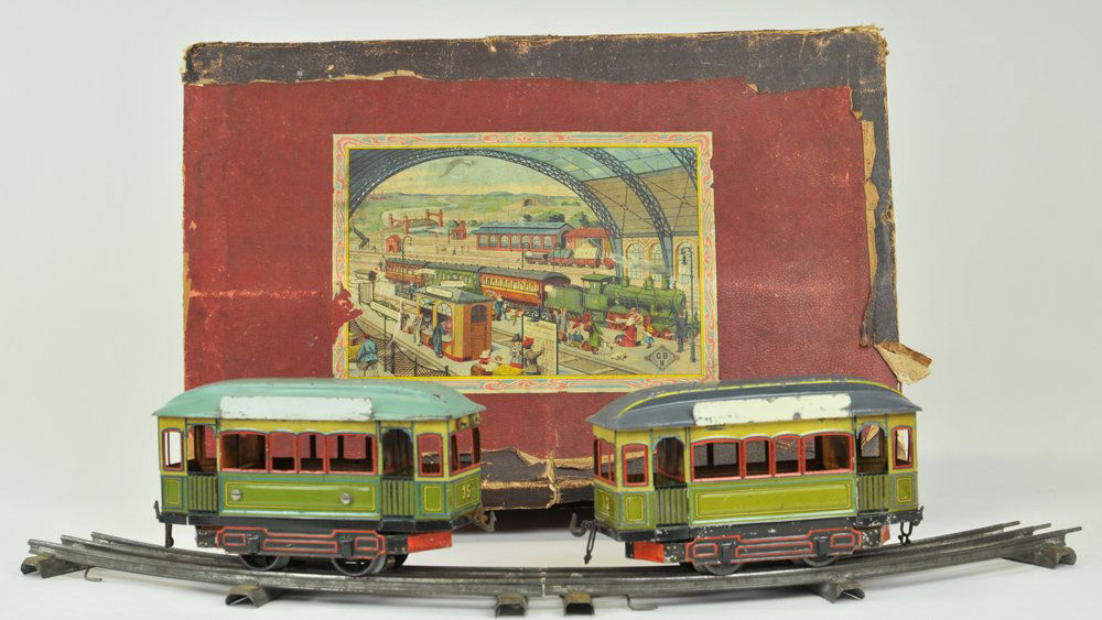 BING BOXED TROLLEY SET: Germany, set includes: Power car and trailer car, together with track accessory, cars are done in lithographed tin, power car is electric, colorful pair, battery-operated also colorful with extensive