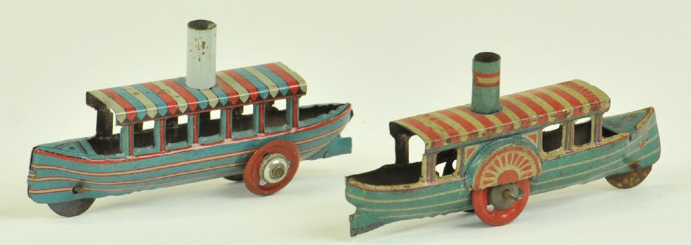 FISCHER AND MEIER PENNY TOY BOATS: Germany, both lithographed tin, each features striped canopy covers over deck, stacks protrude from roofs of canopies, paddle wheels embossed on one. 3" l.