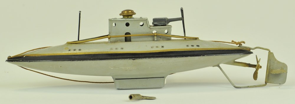 ARNOLD SUBMARINE: Germany, circa 1920, #2003, clockwork diving submarine, painted in greys, gold striping, railed deck, anti-aircraft gun at conn, tin supports on deck. 9" l.