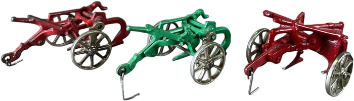 THREE ARCADE FARMING PLOWS