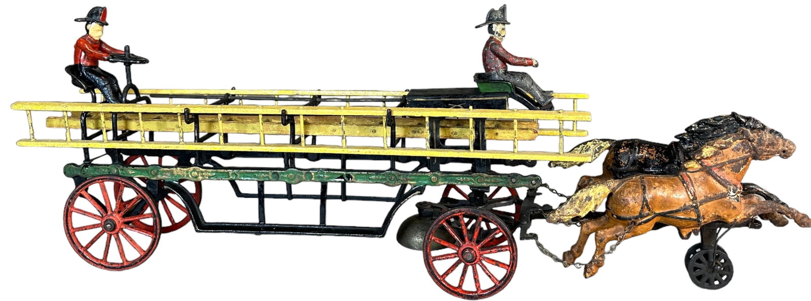 PRATT & LETCHWORTH HOOK & LADDER: 266. PRATT & LETCHWORTH HOOK & LADDER | 26" l. | Original driver figure, wheelman reflects OK under black light but appears to be recast, one horse has overpaint which has been partially cleaned, othe
