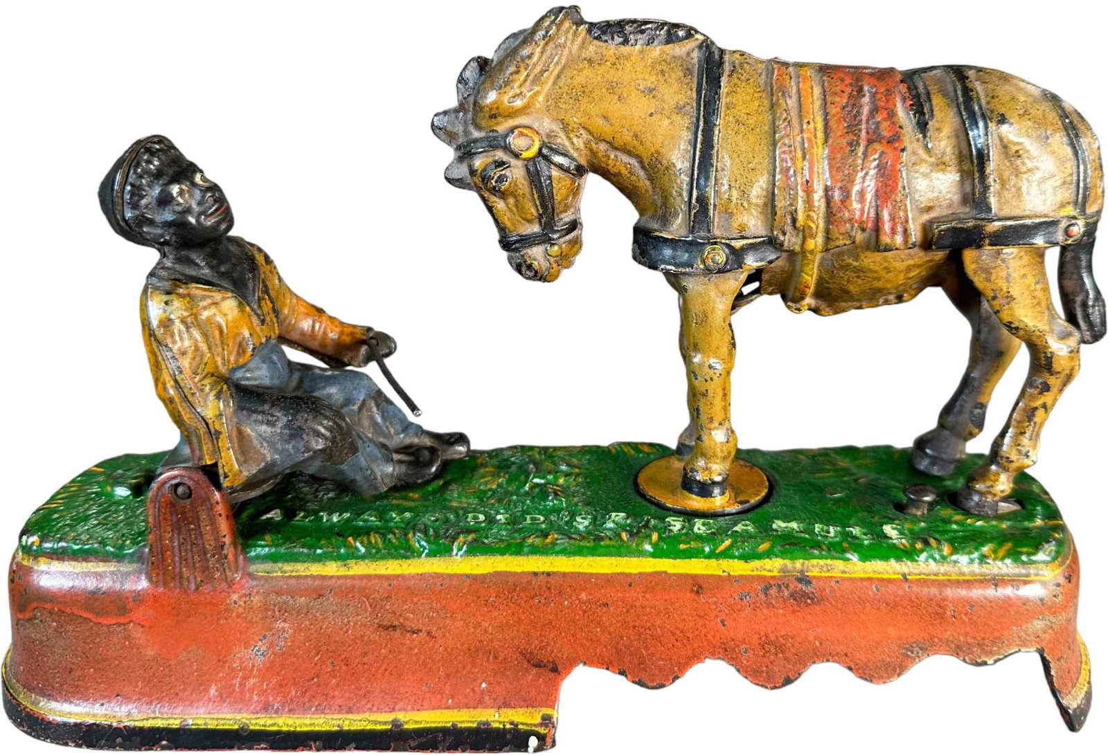 SPISE A MULE MECHANICAL BANK: 383. SPISE A MULE MECHANICAL BANK | J&E Stevens Co. | 10" l. | Missing trap. Top grass surface of bank is repainted, (Very Good Condition) | $300 - $600