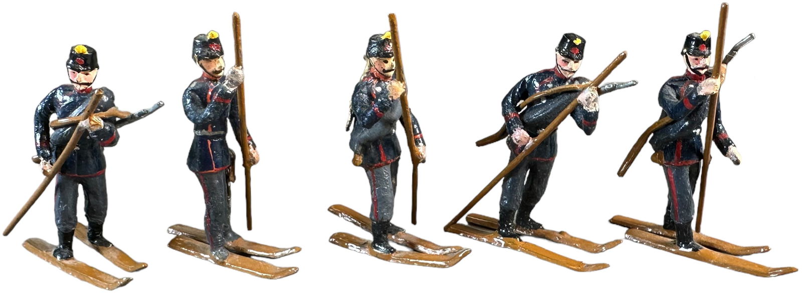 HEYDE RARE SKI TROOPERS: 146. HEYDE RARE SKI TROOPERS | Five soldiers mounted on skis with poles and separate rifles. Provenance: Oscar Hijuelos Collection. | 48 mm | One soldier missing rifle, (Excellent Condition) | $200 -