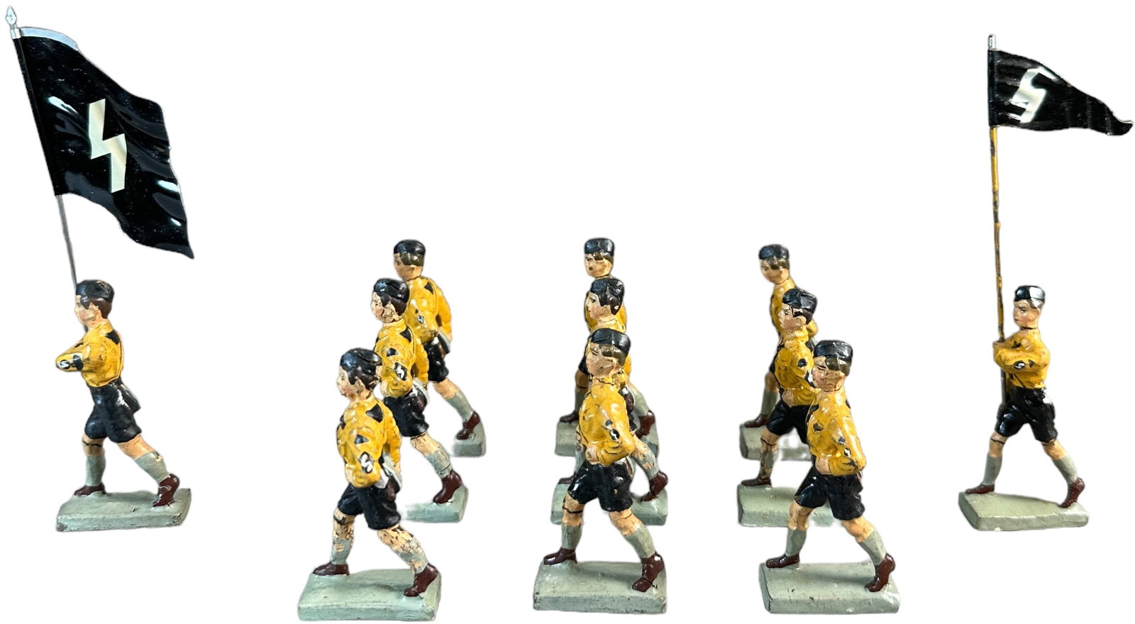LINEOL HITLER YOUTH FIGURES: 160. LINEOL HITLER YOUTH FIGURES | Eleven marching with two flag bearer of Hitler Youth organization very rare figures. | 65 mm | (Very Good Condition) | $400 - $800