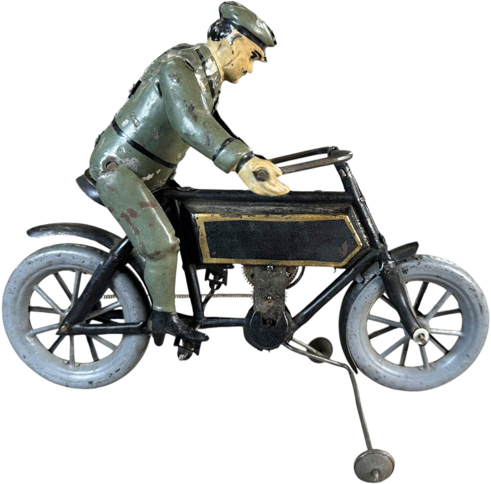 HANS EBERL MOTORCYCLE W/ RIDER: 105. HANS EBERL MOTORCYCLE W/ RIDER | Germany, circa 1906, this is an ultra rare toy to which not many are known, hand painted figure rides an early motorcycle which has an almost bicycle design with