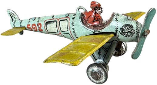 DISTLER MONOCOUPE AIRPLANE PENNY TOY