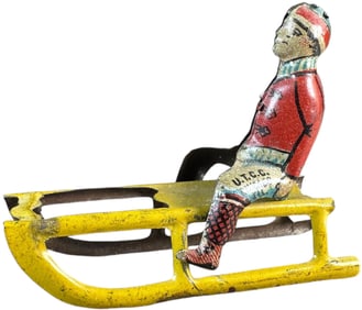 GELY BOY ON SLED UTCC CHICAGO PENNY TOY