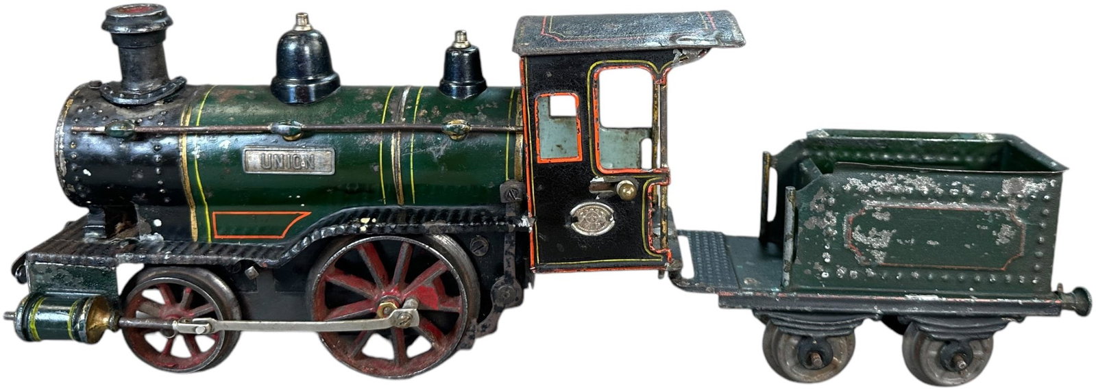 CLOCKWORK ERNST PLANK "UNION" LOCOMOTIVE: 387. CLOCKWORK ERNST PLANK "UNION" LOCOMOTIVE | Gauge 1, clockwork, hand painted, catalog #901B circa 1914. | 10" l. | (Very Good to Excellent Condition) | $500 - $750