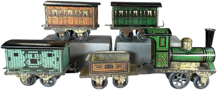ISSMAYER FOR KARL BUB PINK TENDER SET: 423. ISSMAYER FOR KARL BUB PINK TENDER SET | O gauge, wind-up, elaborate detailed lithography on green loco, pink tender, green #500 Coach, pink #500 coach, light blue goods wagon. Ex: Bill Becker Col