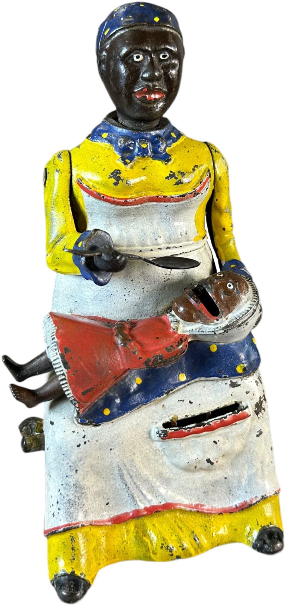 MAMMY & CHILD MECHANICAL BANK: 1301. MAMMY & CHILD MECHANICAL BANK | Kyser & Rex Co., desirable yellow dress and bright colors with minor chipping from activation, as with most the spoon is replaced and the baseplate is a replaceme