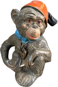MONKEY HOLDING CIGARETTE SPELTER BANK
