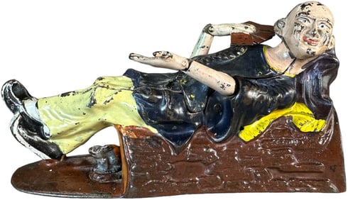 RECLINING CHINAMAN MECHANICAL BANK