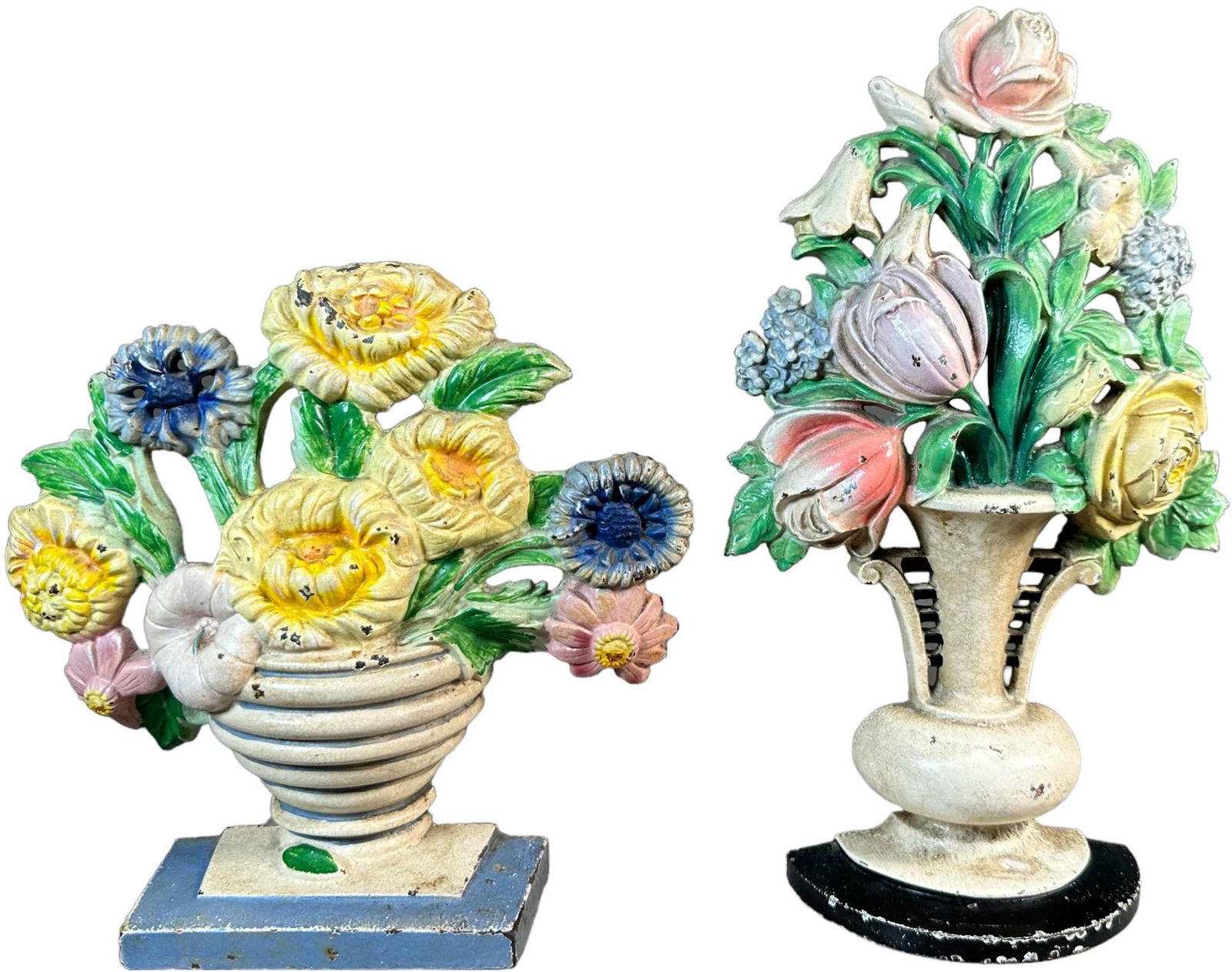 TWO HUBLEY FLORAL DOORSTOPS: 1357. TWO HUBLEY FLORAL DOORSTOPS | Marigolds marked "315", Tulips and Roses marked "465. | 10.5" h. | (Excellent to Pristine Condition) | $200 - $400
