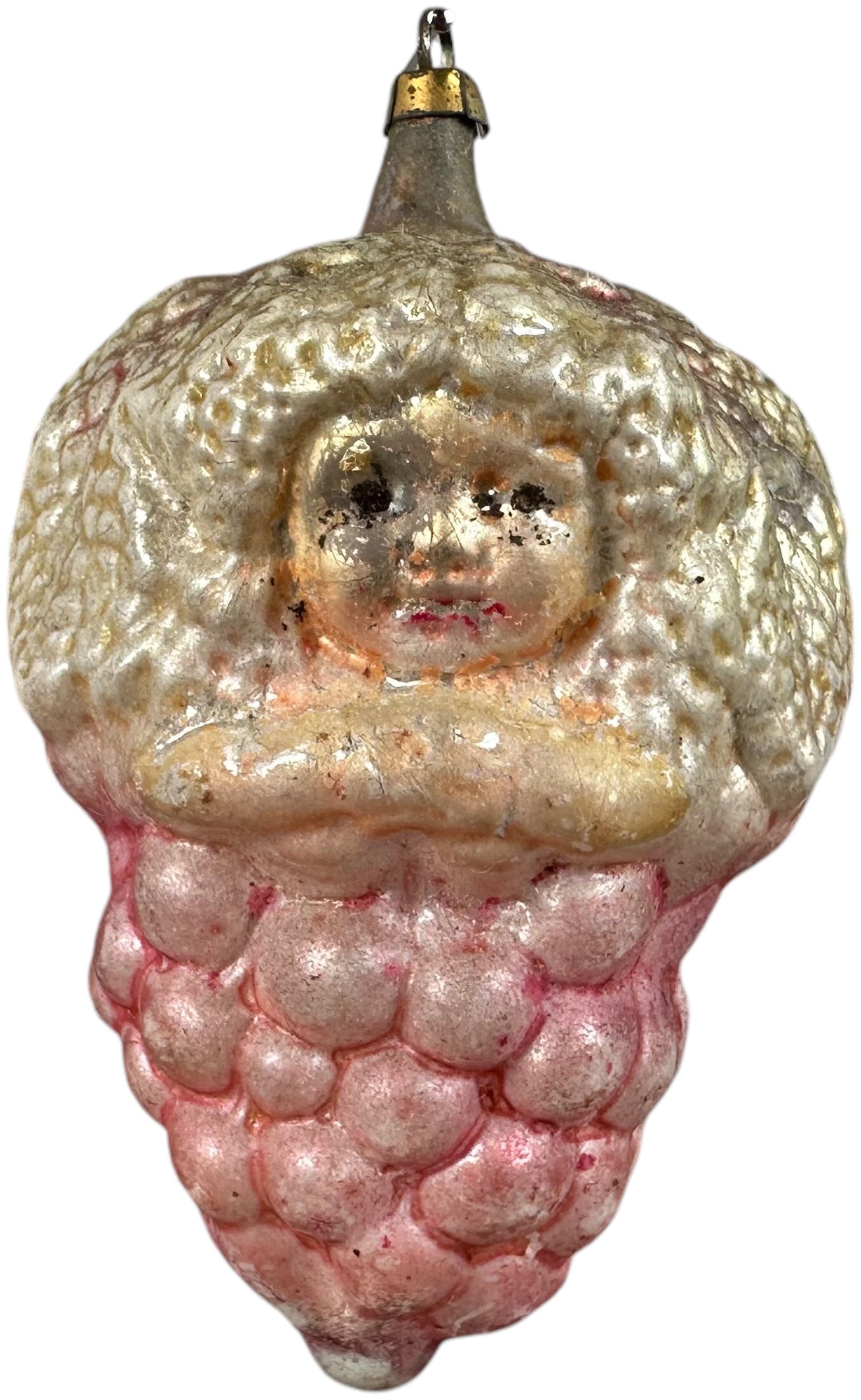 GIRLS HEAD IN GRAPES GLASS ORNAMENT: 65. GIRLS HEAD IN GRAPES GLASS ORNAMENT | Large ornament with brass cap. | 3.5" l. | Inpainting on one spot, (Excellent Condition) | $300 - $500