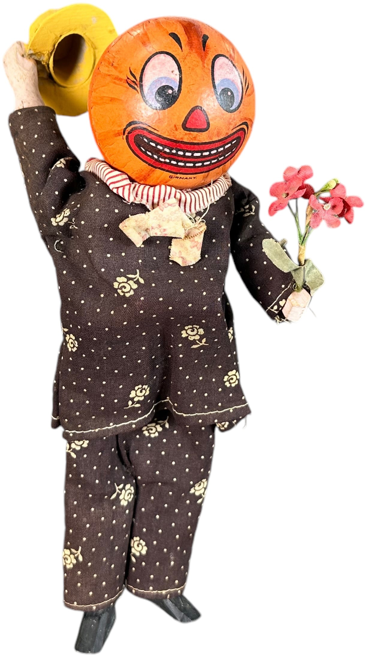 GERMAN PUMPKIN MAN TIPS HAT SQUEEZE TOY: 115. GERMAN PUMPKIN MAN TIPS HAT SQUEEZE TOY | Squeeze torso and he tips his hat. | 10" h. | Hat is repainted or replaced, bellows squeaker has torn paper but still activates the tipping movement, (Ex