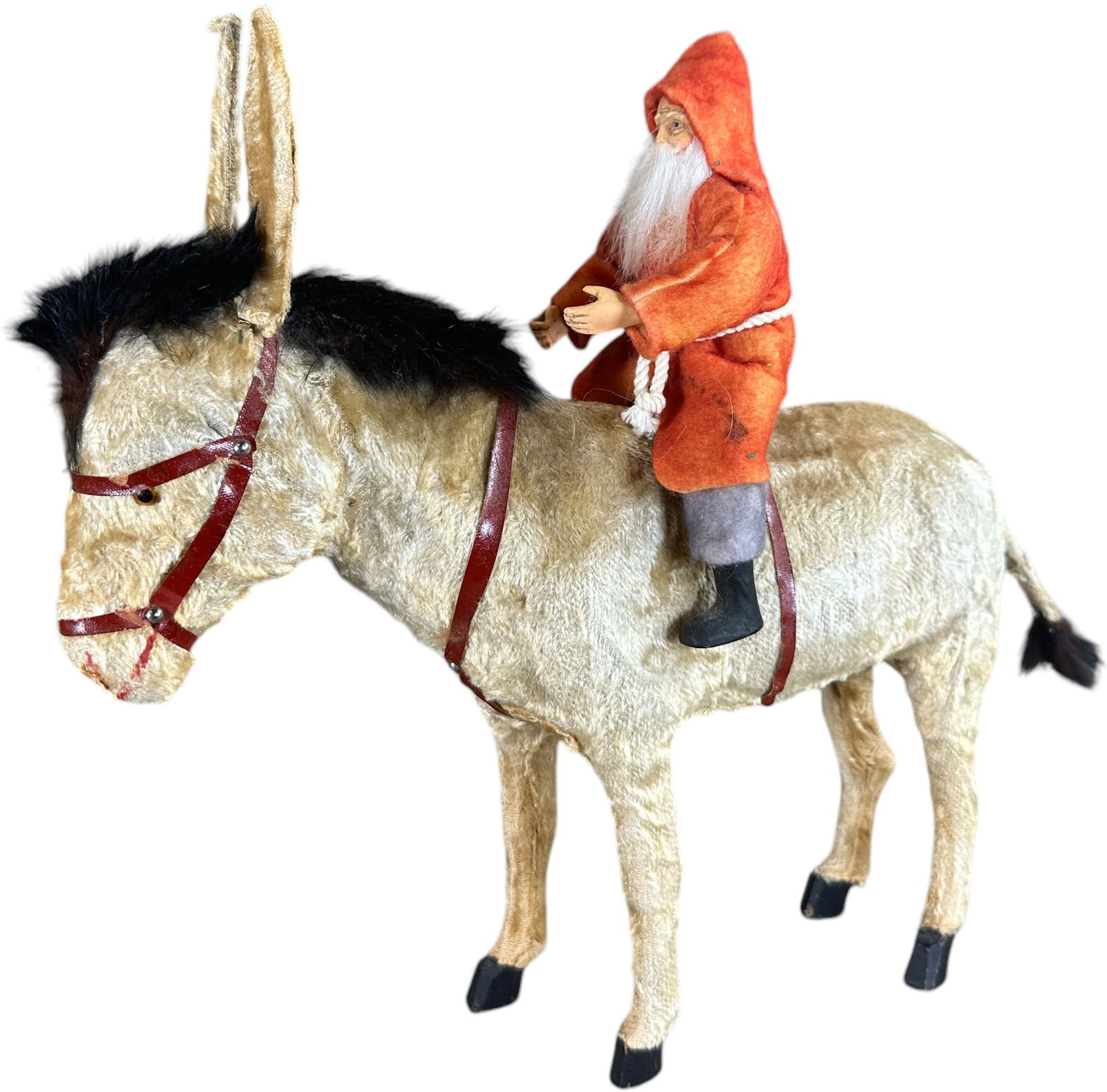 SANTA RIDING GALLOPING DONKEY: 382. SANTA RIDING GALLOPING DONKEY | Very nice wind-up action causes the Santa Claus figure to lean forward and back as the Donkeys head and tail alternate a forward and back motion. | 13.5" l. | (Ver