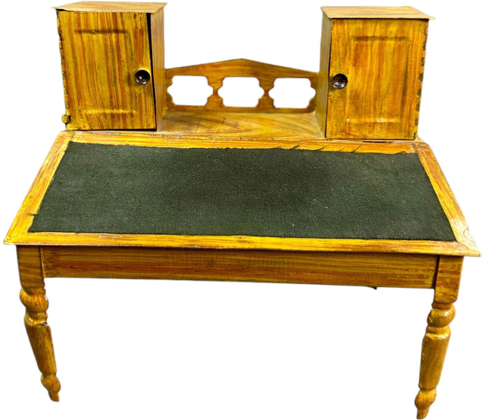 ELLIS, BRITTON & EATON MINIATURE DESK: 161. ELLIS, BRITTON & EATON MINIATURE DESK | Circa 1869, early American painted tin slant front desk with faux wood grained finish, hinged opening front cover and two upper cabinets with hinged doors.