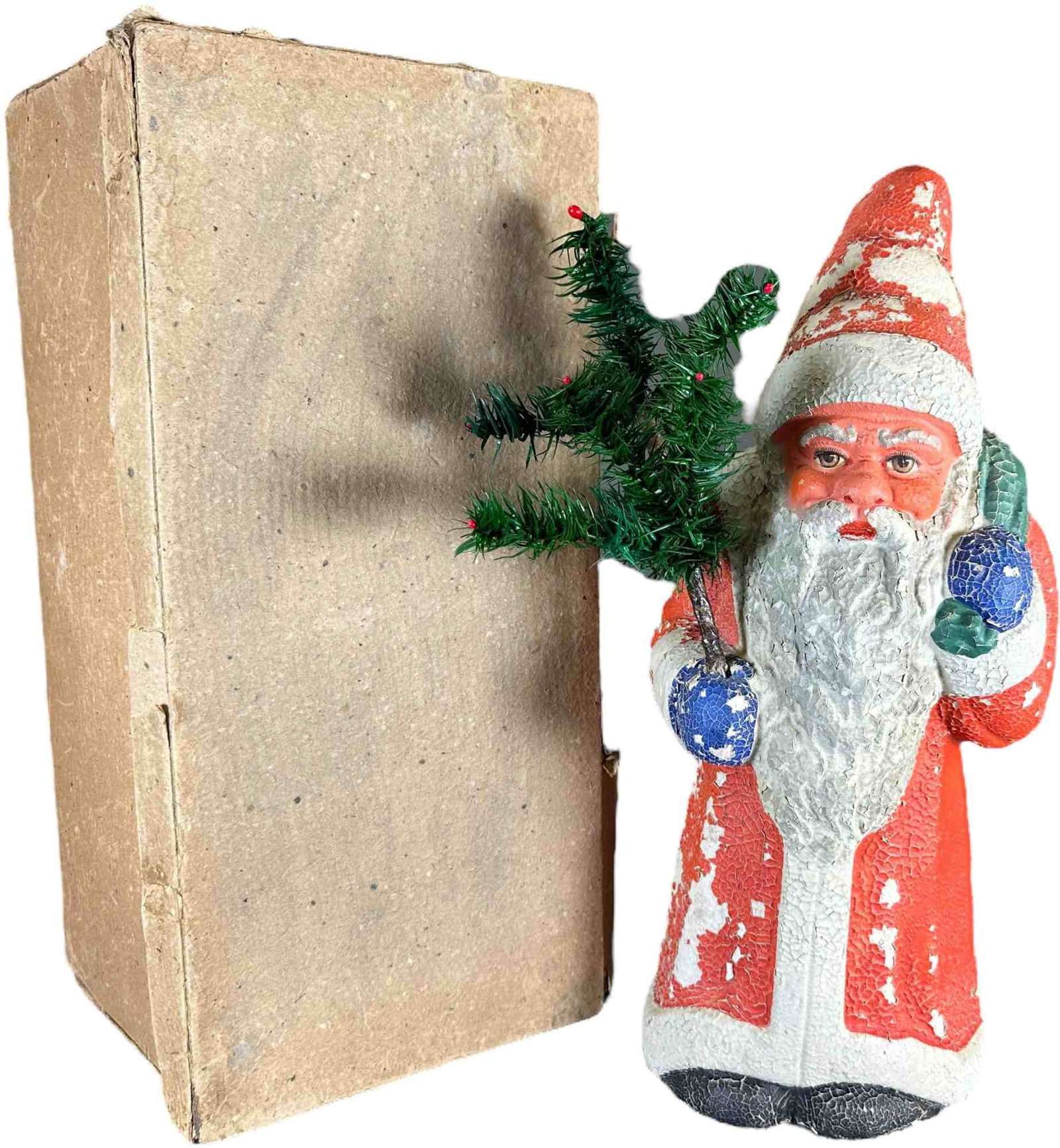BOXED PAPER MACHE SANTA: 381. BOXED PAPER MACHE SANTA | Original box. | 15" h. | Original paint is cracking, (Very Good Condition) | $200 - $400